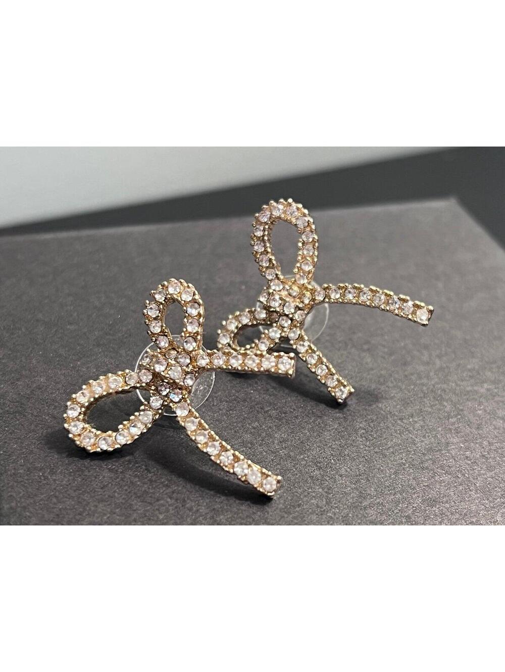 Bow Shaped Stud Earrings in Gold w/ Pave Cubic Zirconia - Picture 2 of 11